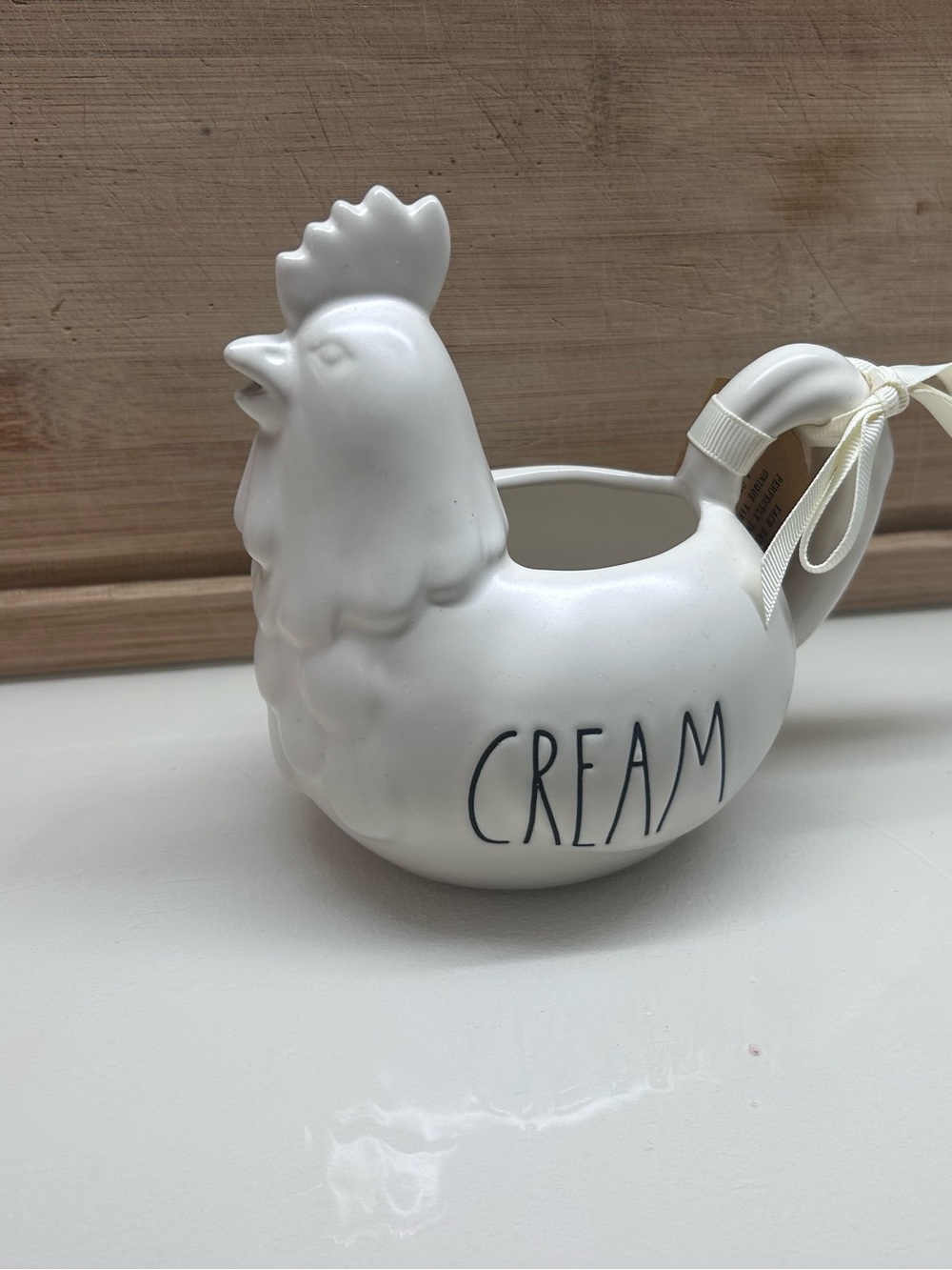 Rae Dunn White Ceramic Hen Pitcher labeled CREAM